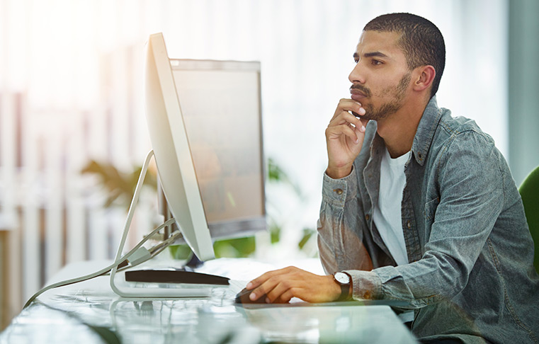 Men Looking At Computer